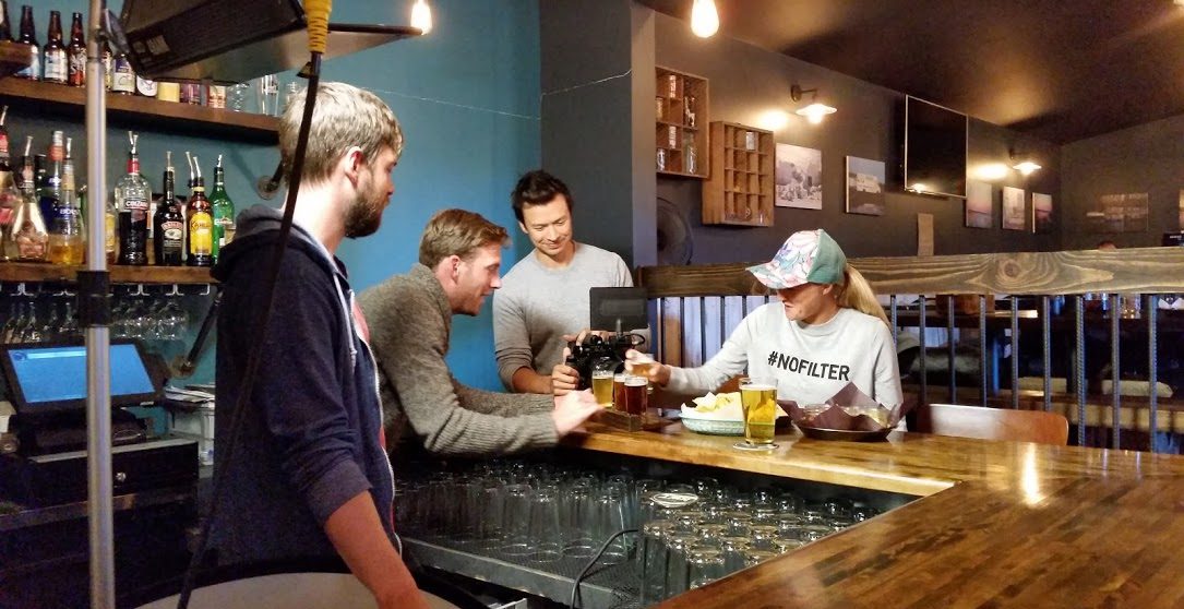 Lordon (second from the left) setting up a tasting scene at a mircobrewary in NWT Image: Ryan Cox 