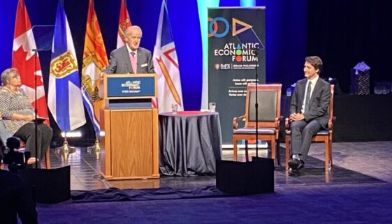 Former Prime Minister Brian Mulroney introduces Justin Trudeau at the opening night of the Atlantic economic forum (Photo by Joe Thomson)